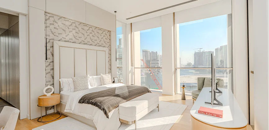 Residence 22 master bedroom with floor-to-ceiling windows and canal views